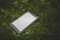 digital-tablet-in-wet-grass-1.jpg